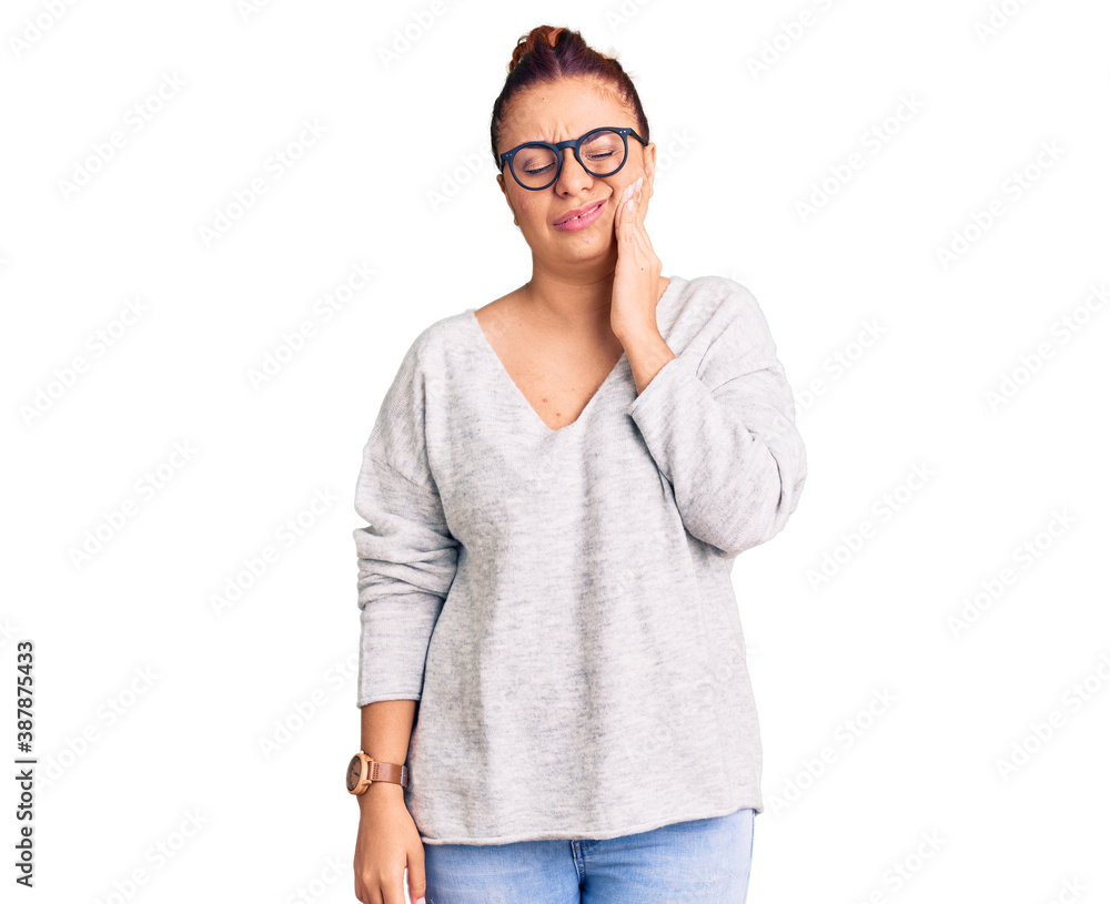 Young latin woman wearing casual clothes touching mouth with hand with painful expression because of toothache or dental illness on teeth. dentist Young latin woman wearing casual clothes touching mouth with hand with painful expression because of toothache or dental illness on teeth. dentist
