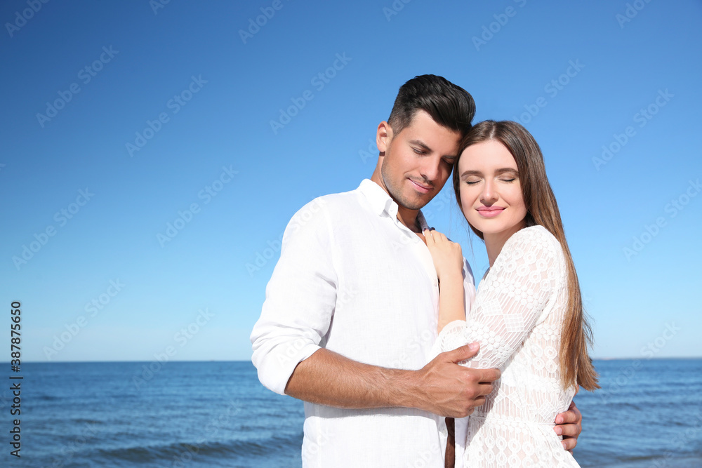 Lovely couple together on beach. Summer vacation