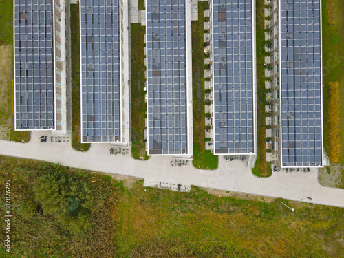 Top down view aerial of solar panels on urban houses home house hould renewable photo