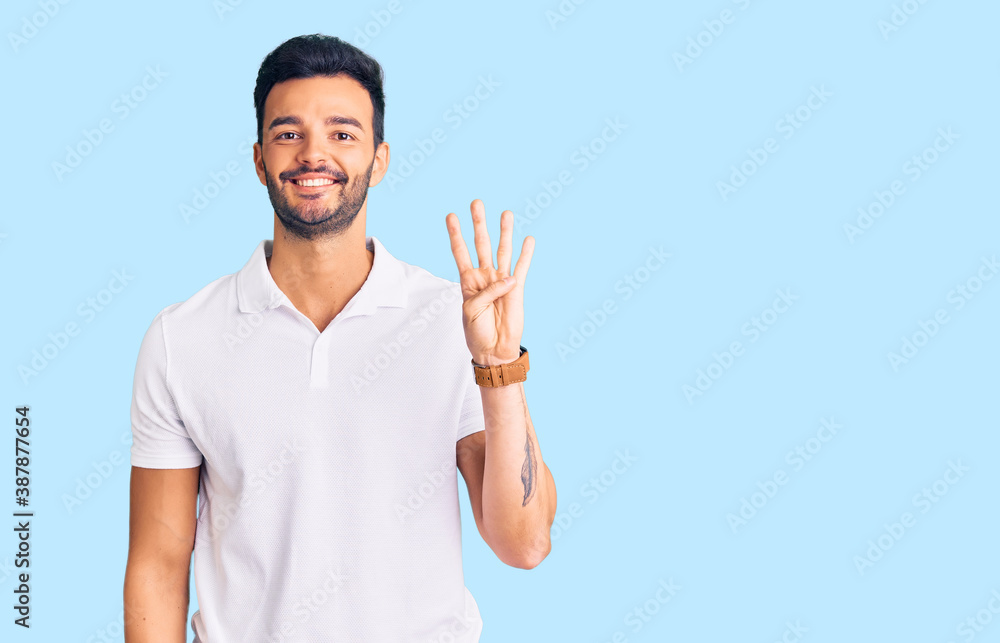 Young handsome hispanic man wearing casual clothes showing and pointing up with fingers number four while smiling confident and happy. Young handsome hispanic man wearing casual clothes showing and pointing up with fingers number four while smiling confident and happy.