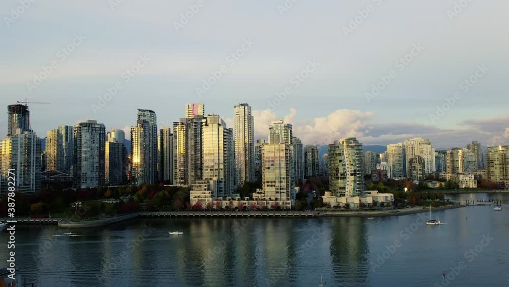 Vancouver downtown during sunset with a beautiful gold light and fall trees Vancouver downtown during sunset with a beautiful gold light and fall trees