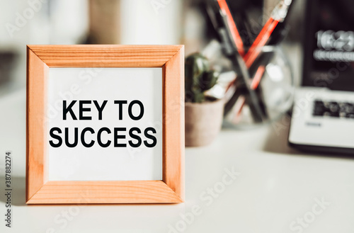 The key to success is a frame on the desktop, an isolated white background. photo