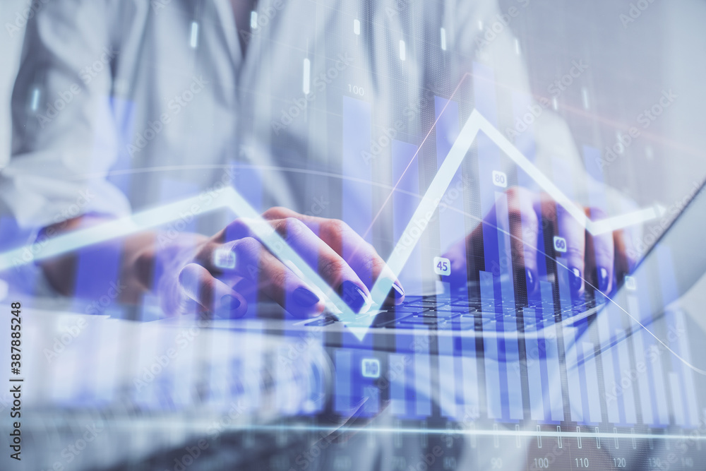Double exposure of woman hands typing on computer and forex chart hologram drawing. Stock market invest concept. Double exposure of woman hands typing on computer and forex chart hologram drawing. Stock market invest concept.