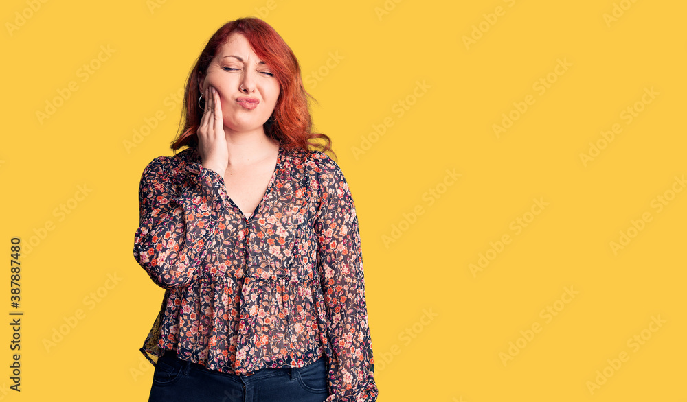 Young beautiful redhead woman wearing casual t-shirt touching mouth with hand with painful expression because of toothache or dental illness on teeth. dentist Young beautiful redhead woman wearing casual t-shirt touching mouth with hand with painful expression because of toothache or dental illness on teeth. dentist