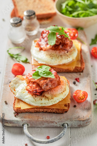 Tasty toast with egg, cheese and bacon