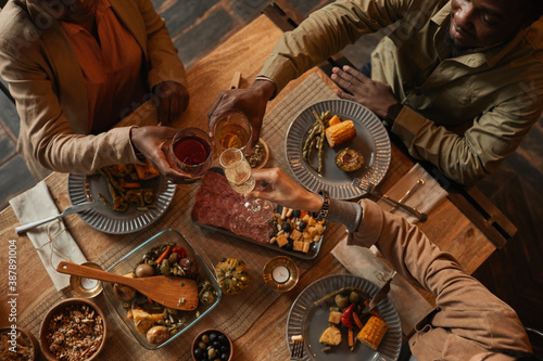 Canvas Print Top view background of multi-ethnic group of people enjoying feast during dinner