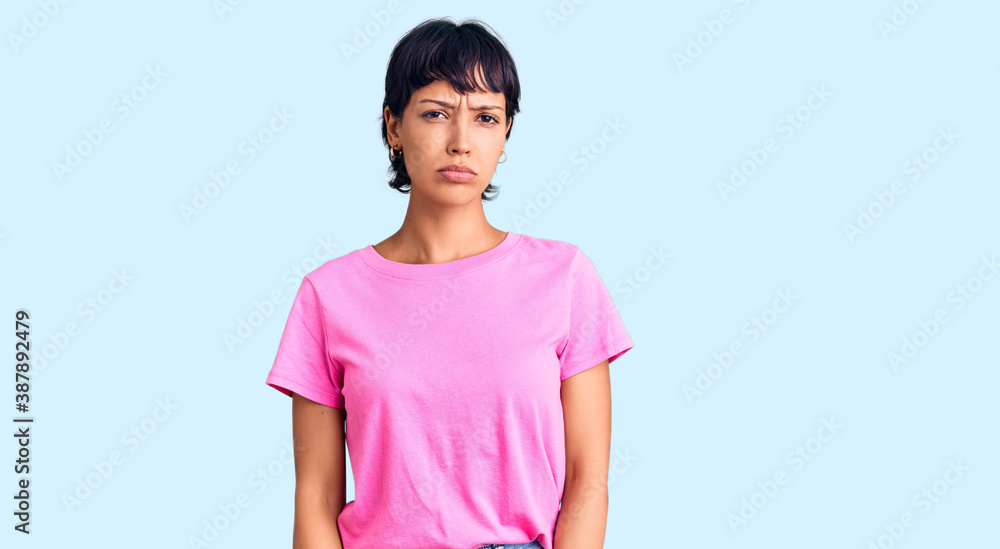 Young brunette woman with short hair wearing casual clothes depressed and worry for distress, crying angry and afraid. sad expression. Young brunette woman with short hair wearing casual clothes depressed and worry for distress, crying angry and afraid. sad expression.