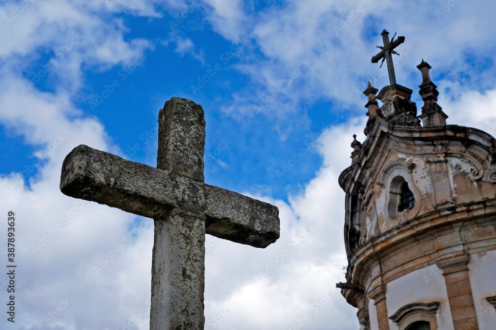 Cross and baroque church in background, Ouro Preto, Brazil 