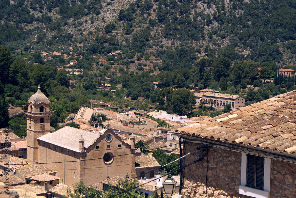 Bunyola village. Town of Mallorca with Tramuntana mountains in the background. Church and typical Balearic islands houses.