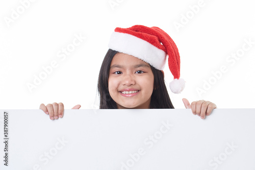 Happy little girl holding a blank board