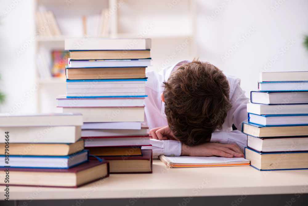 Schoolboy preparing for exams in the classroom Schoolboy preparing for exams in the classroom