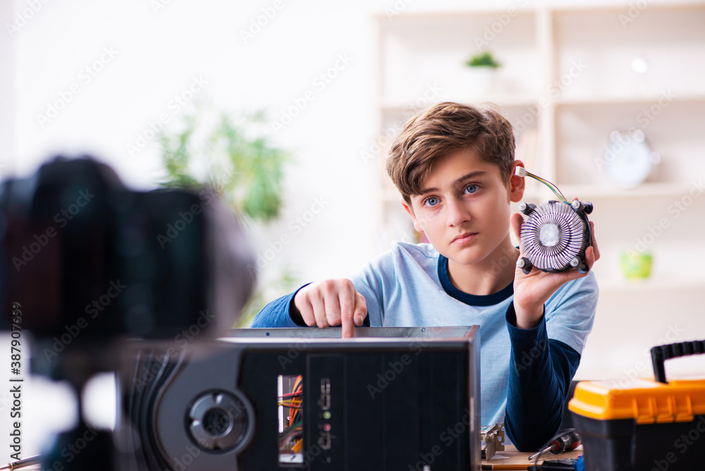 Boy computer repairman recording video for his blog Boy computer repairman recording video for his blog