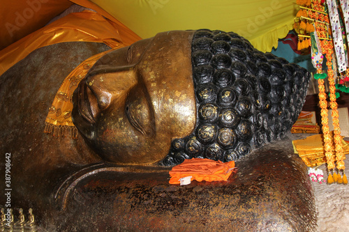 Golden Reclining Buddha reaching Nirvana on Phnom Kulen Mountain in Siem Reap photo