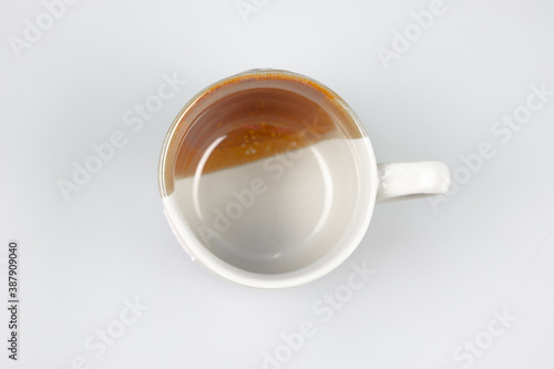 blank four coffee cup. white glass on white background. Ceramic cup top view.