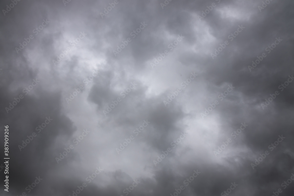 black and white storm clouds background. Light in the Dark and Dramatic Storm Clouds background, Dark clouds before a thunder-storm. black and white storm clouds background. Light in the Dark and Dramatic Storm Clouds background, Dark clouds before a thunder-storm.