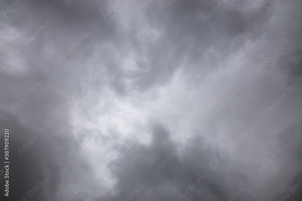black and white storm clouds background. Light in the Dark and Dramatic Storm Clouds background, Dark clouds before a thunder-storm. black and white storm clouds background. Light in the Dark and Dramatic Storm Clouds background, Dark clouds before a thunder-storm.