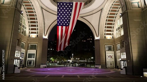 Boston, Massachusetts, USA  A large American flag hangs in the rotunda at the harborwalk.