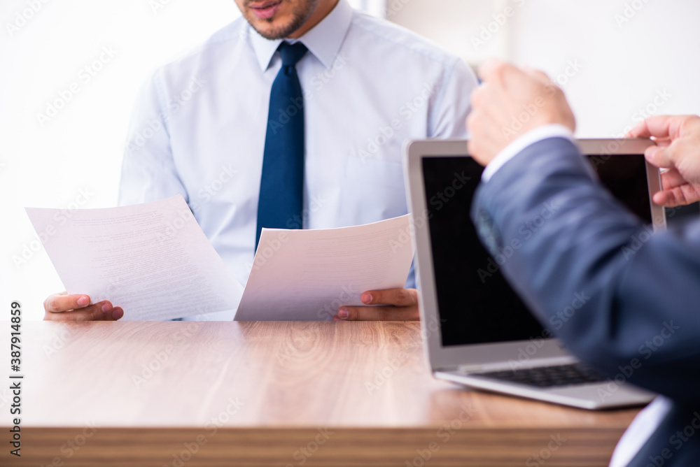 Young male candidate employee meeting with old recruiter Young male candidate employee meeting with old recruiter