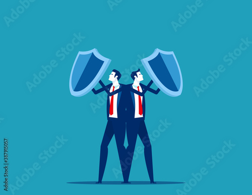 Team holding shields against business. Teamwork unity