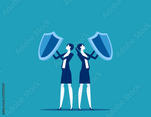 Team holding shields against business. Teamwork unity