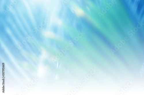 Light blue Leaf background. Blurred leaves and circular bokeh. Abstract for design and wallpaper. © kikk
