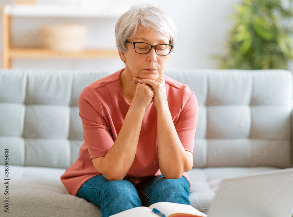 senior woman is using laptop senior woman is using laptop