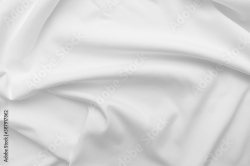 Abstract white fabric texture background. Cloth soft wave. Creases of satin. silk and cotton.