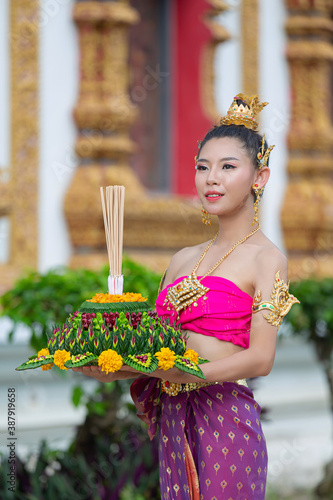 Asia woman in Thai dress traditional hold kratong. Loy krathong festival