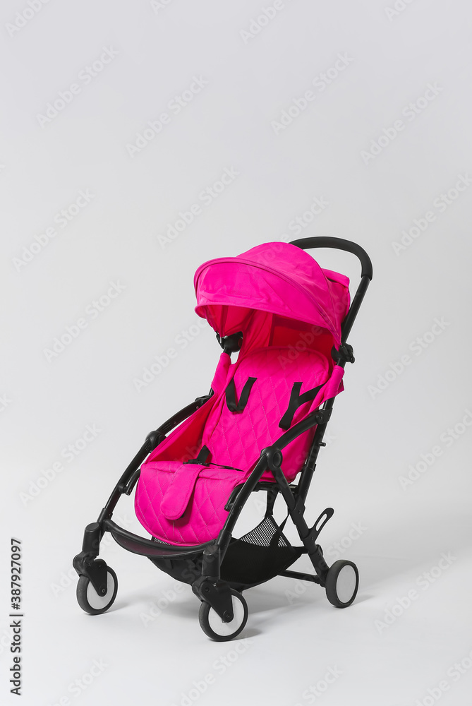 Modern baby stroller on light background Modern baby stroller on light background