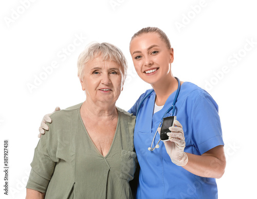 Doctor and senior diabetic ...