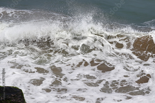 Background pattern of rising sea water on high tide during rainy days