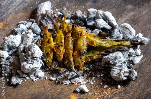 Indian Carplet Fish or Mourala Fish in Charcoal with Selective Focus photo