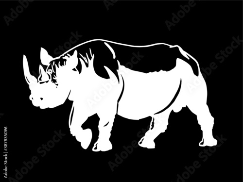 Vector rhinoceros on black background , engraved illustration