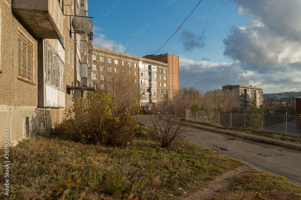One of the streets of the city. Empty street. Autumn cityscape. Old residential area. Architecture old and new. Ust-Kamenogorsk (Kazakhstan) One of the streets of the city. Empty street. Autumn cityscape. Old residential area. Architecture old and new. Ust-Kamenogorsk (Kazakhstan)