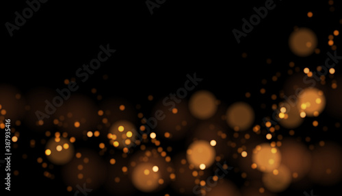 Vector abstract background with blurred golden lights. Gold bokeh texture. Festive luxury backdrop with glowing light effect. 