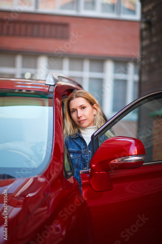 beautiful girl near red car, businesswoman