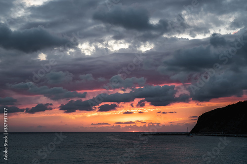 Black sea sunset in thunderclouds