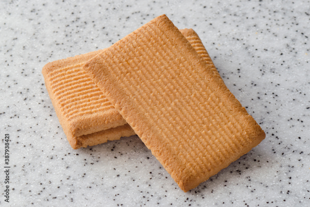 Rectangular shortbread cookies on a light marble top. Homemade baking. Rectangular shortbread cookies on a light marble top. Homemade baking.