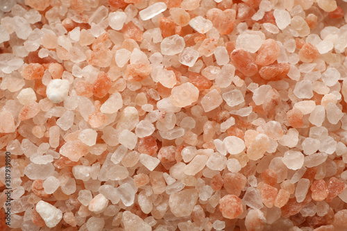 Pink himalayan salt on whole background, close up