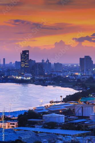 Bangkok skyline and Chao Phraya river at twilight.