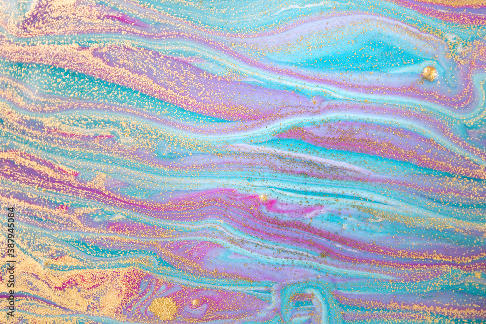 Blue and pink bright wave pattern with layers of gold sequins. Blue and pink bright wave pattern with layers of gold sequins.