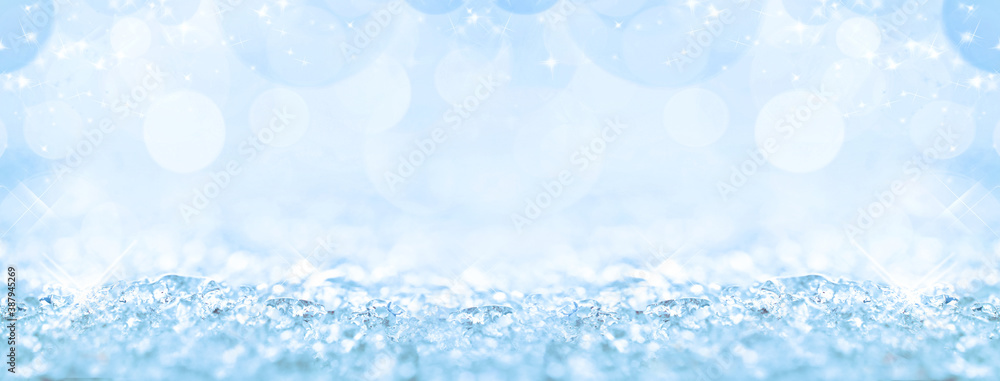 White snow and bokeh Christmas lights, holiday panoramic background with copy space