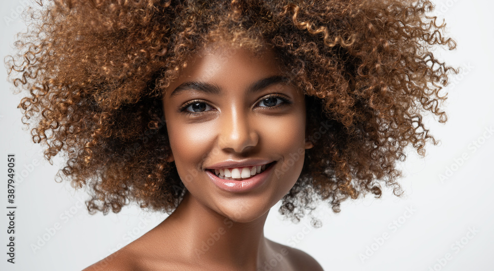 Beauty portrait of african american girl with clean healthy skin on beige  background. Smiling dreamy beautiful black  hair in afro style  Stock Photo | Adobe Stock