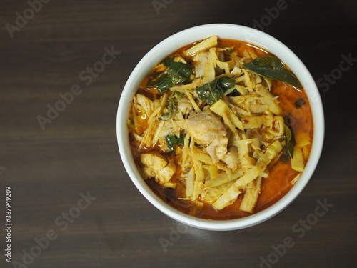 Red Curry with Chicken and Bamboo Shoots in white bowl, Thai food