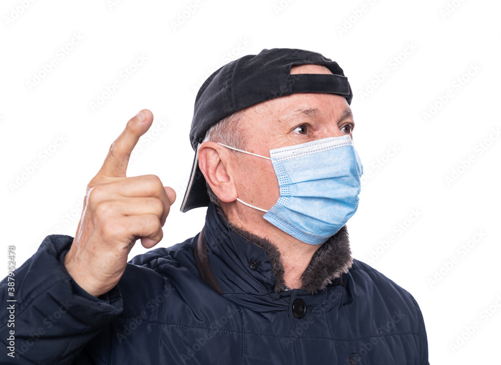 Senior man in protective mask posing in studio over white background Senior man in protective mask posing in studio over white background