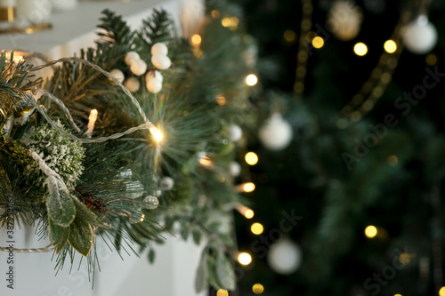 Christmas tree on a gray background. garland  white balls