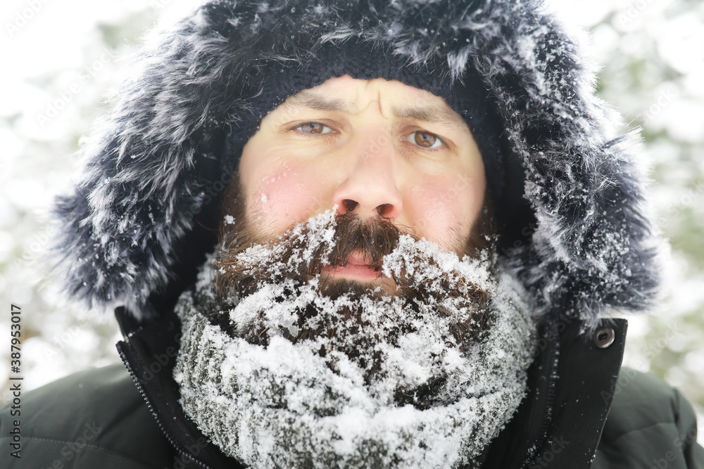 Bearded man in the winter woods. Attractive happy young man with beard walk in the park. Bearded man in the winter woods. Attractive happy young man with beard walk in the park.