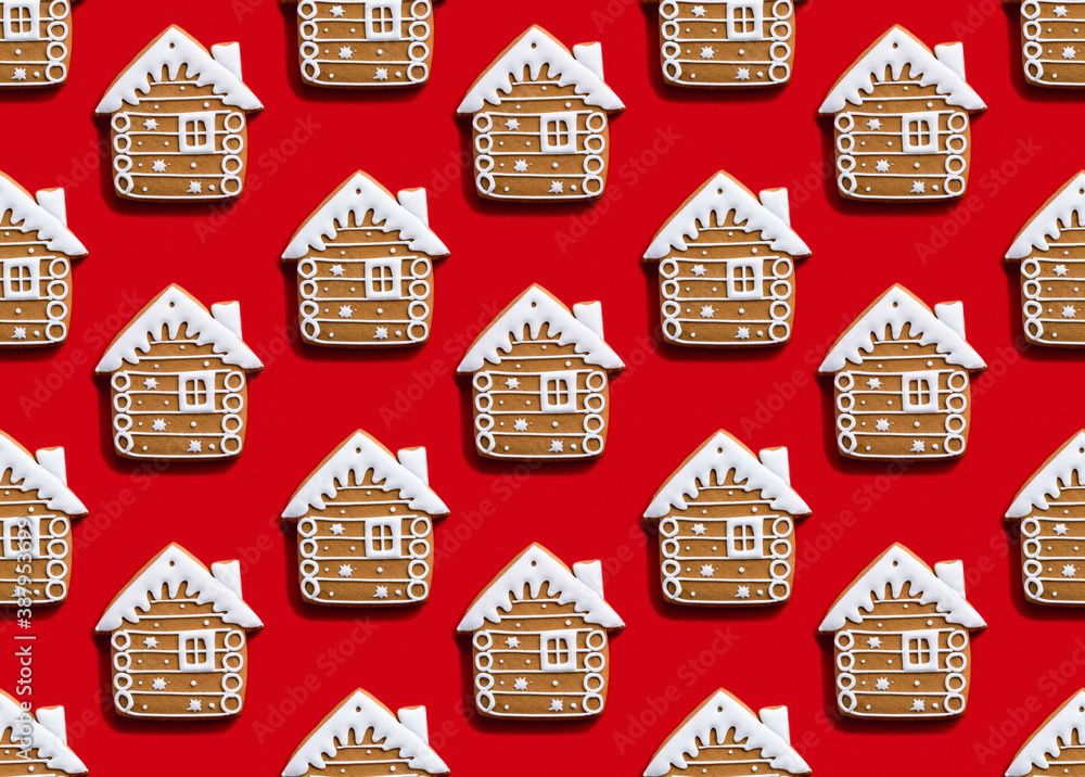 Gingerbread house pattern. Red seamless background. Christmas food ornament. Brown homemade biscuit with white icing minimalist symmetrical arrangement isolated on bright.