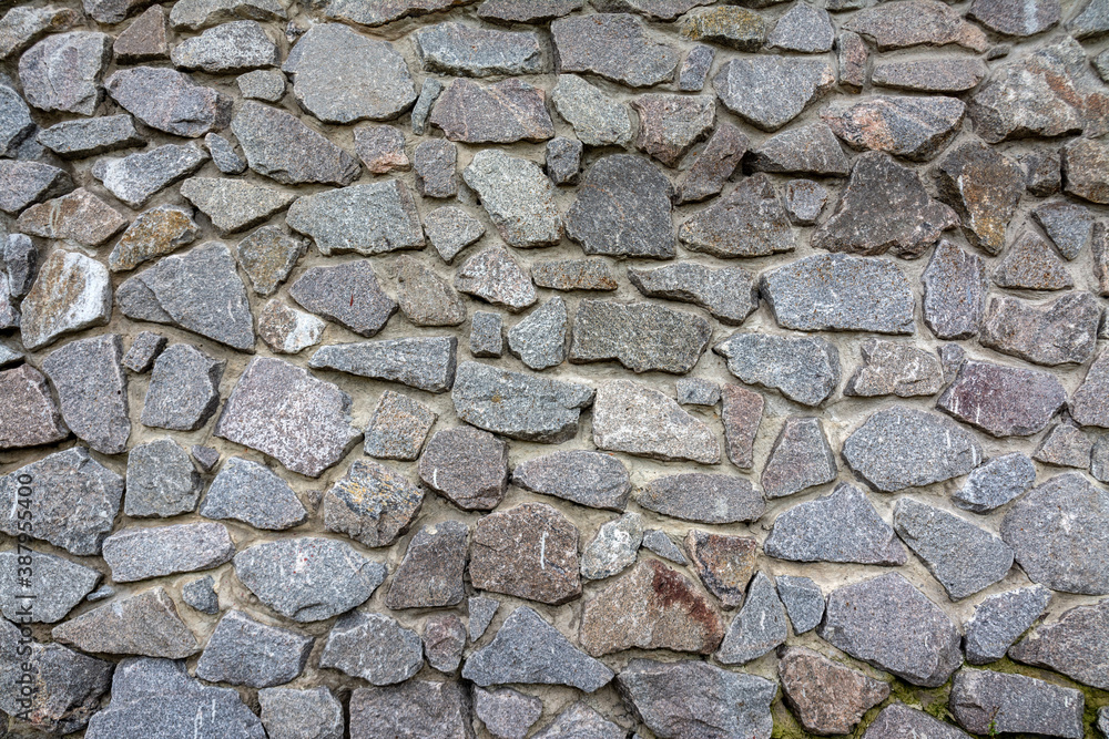 A cobbled road or a cobblestone wall of an old building A cobbled road or a cobblestone wall of an old building