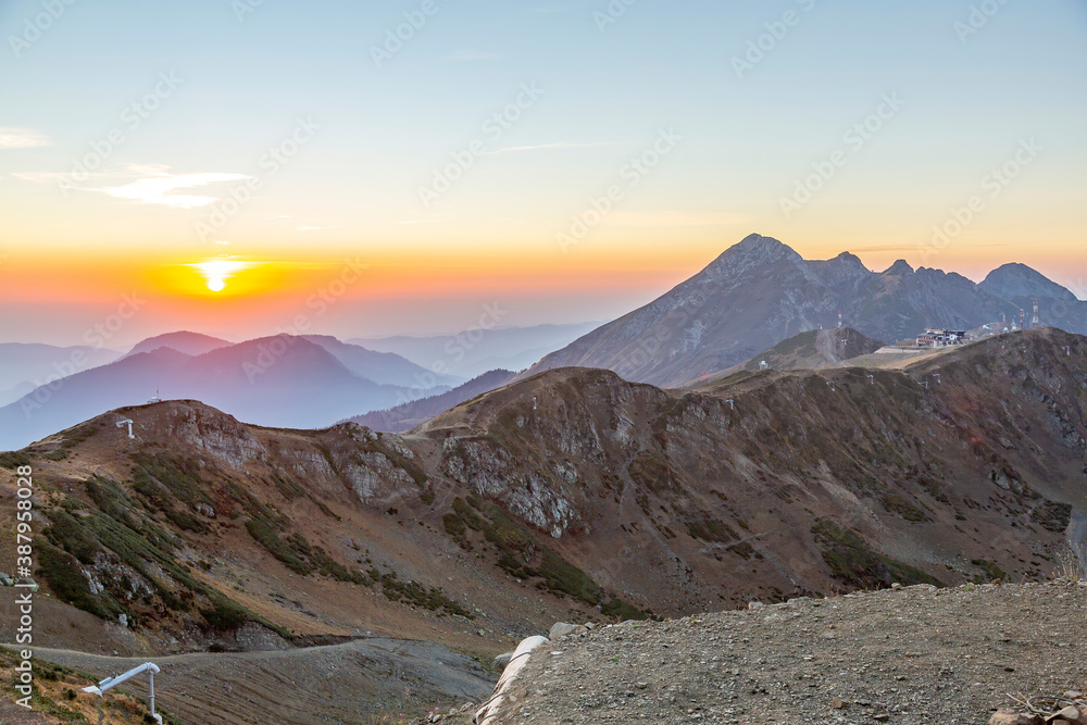 Colorful sunset and autumn mountain landscape in the resort of Rosa Khutor in Russia